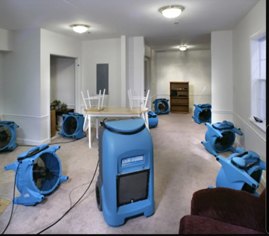 Air movers and dehumidifier setup for Water Damage Restoration in Heath