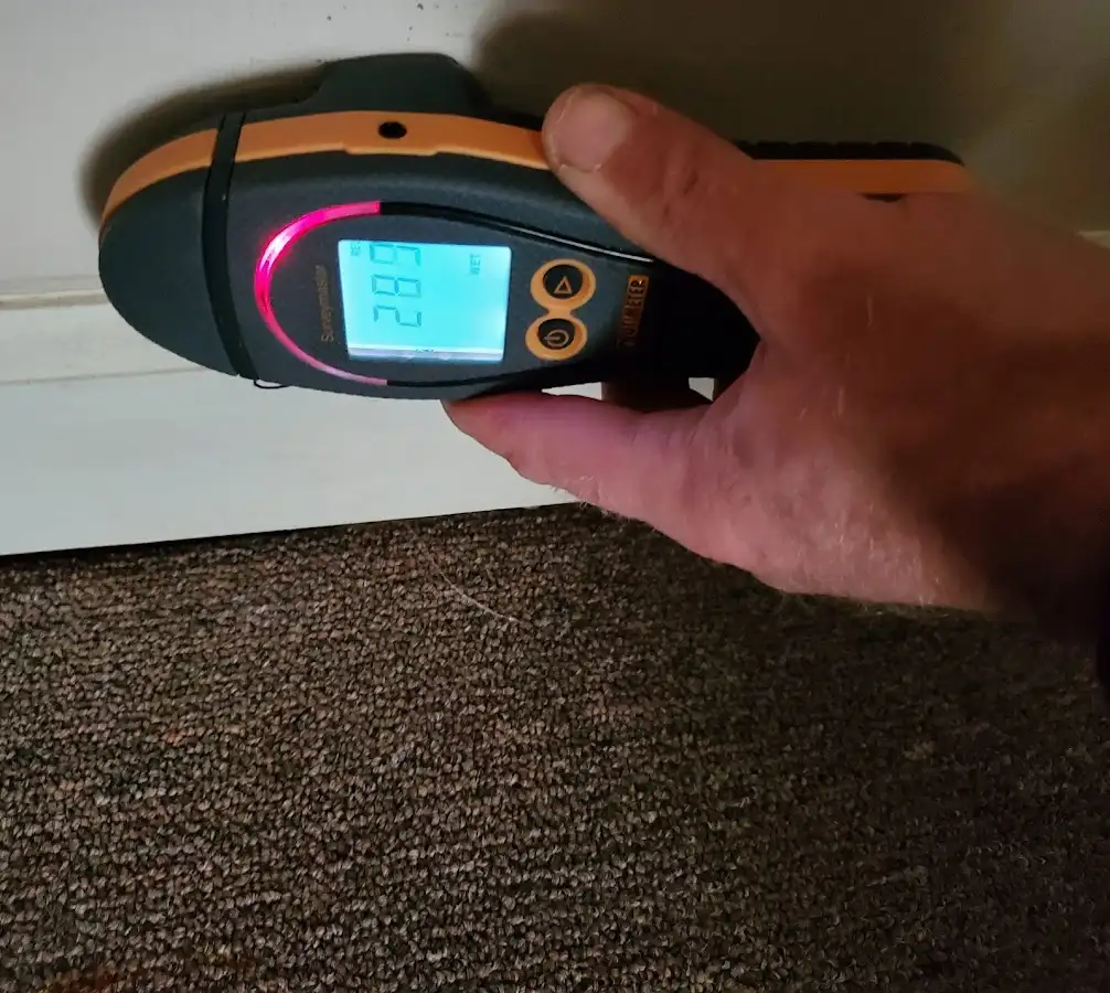 Moisture detection at baseboard during Sewage Cleanup & Sanitation in Heath